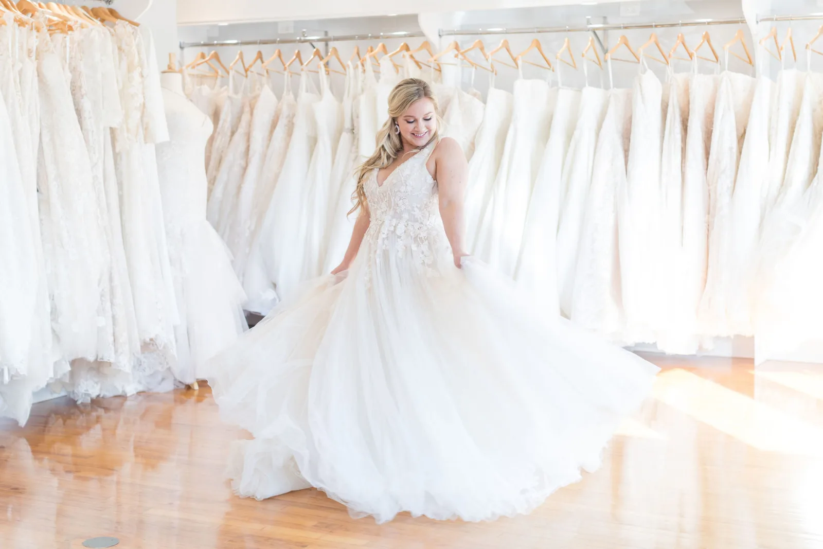 A bride finding her dress at Olivia Grace Bridal Shop